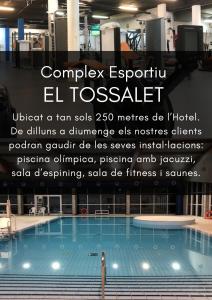 a poster of a swimming pool with a quote at Hotel Estel in Berga