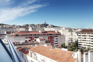 a view of a city from a balcony at Appart'hôtel Odalys City - Marseille Centre Parc Chanot Vélodrome in Marseille