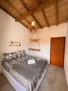 Postel nebo postele na pokoji v ubytování Casa Viva Caraíva