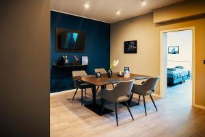 a dining room with a table and chairs at Liro Hotel Oberhausen in Oberhausen