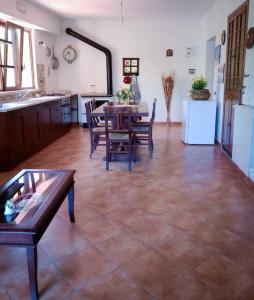 a kitchen and dining room with a table and chairs at Casa Silvia Balsorano in Balsorano Vecchio +14 photos