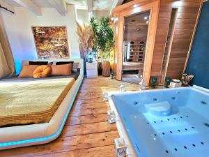 a bathroom with a large tub in a bedroom at AMA Esclusive SPA Bologna in Bologna