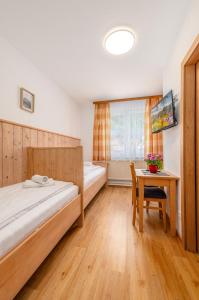 Letto o letti in una camera di s'Wirtshaus by Alpine Genusswelten