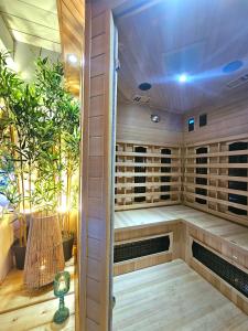 an empty sauna with plants in a room at AMA Esclusive SPA Bologna in Bologna +32 photos