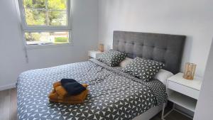 a bedroom with a bed with a backpack on it at Casa Aciano - Albir in L’Alfàs del Pi +28 photos