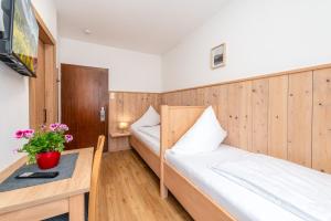 Letto o letti in una camera di s'Wirtshaus by Alpine Genusswelten
