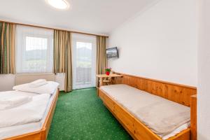 Letto o letti in una camera di s'Wirtshaus by Alpine Genusswelten