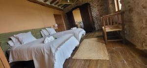 Una cama o camas en una habitación de Casa de las Eras 29 fotos más