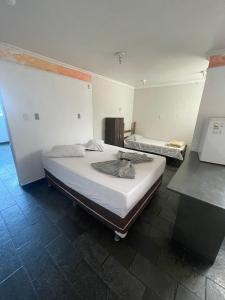 Ένα ή περισσότερα κρεβάτια σε δωμάτιο στο Hotel Estação Norte