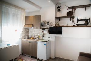 a small kitchen with a sink and a counter at B&B MaVa in Crotone
