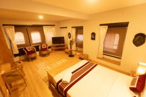 a large room with a bed and a television at Subha Casa Hotel in Pātan