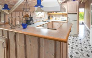 a kitchen with a large island with a counter top at Holiday Home Teglbakken Vi in Egernsund
