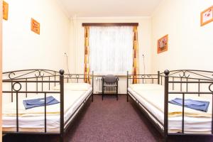 Posteľ alebo postele v izbe v ubytovaní Hotel Grand