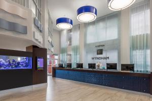 a waiting room with a fish tank in a mall at Club Wyndham Palm-Aire in Pompano Beach