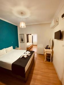 a bedroom with a large bed with a blue wall at Adora Hotel in Istanbul +57 photos