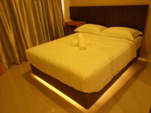 Postel nebo postele na pokoji v ubytování Hotel Vevo Puchong Malaysia