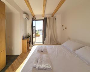 Postel nebo postele na pokoji v ubytování Suite Torre San Giorgio + 10 fotografií