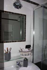 a bathroom with a sink and a mirror at B&B Cascina Barolo in Turin