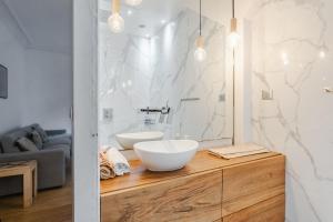 a bathroom with a white sink and a mirror at Beautiful family flat nearby the Flea Market, Stade de France, Montmartre in Saint-Ouen +19 photos