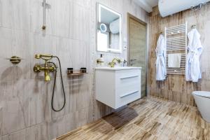 a bathroom with a sink and a shower at Villa Nikol Apartment #1 in Raduil