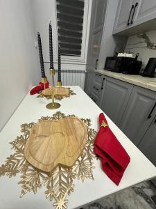 a kitchen counter with two wooden cutting boards on it at Cozy Escape Apartment in Tecuci +22 photos