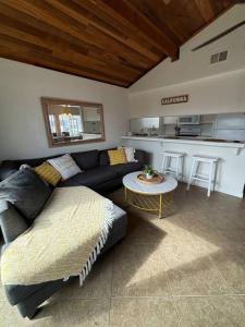 a living room with a couch and a table at Newport Beach Rendezvous in Newport Beach +5 photos