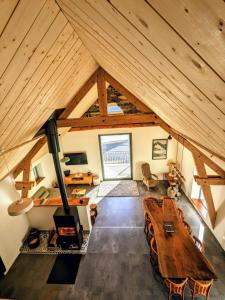 an overhead view of a living room with a large wooden table at Gîte Le Cerbillona- Gavarnie, France in Gavarnie