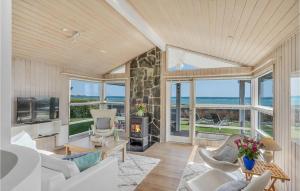 a living room with a view of the ocean at Holiday Home Kystvej Bjert Ix in Binderup Strand