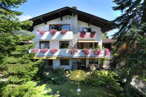 a building with flower boxes on the balconies at Apartment Haus Janine in Westendorf
