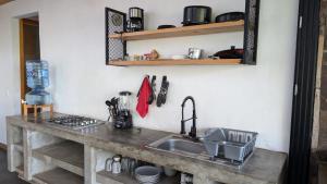 Kuchyň nebo kuchyňský kout v ubytování Cabaña La Finca Mazamitla