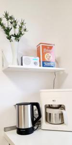 a coffee pot sitting on top of a coffee maker at Ferien-und Monteurwohnung 'Friedersdorfer Mühle' in Pressig