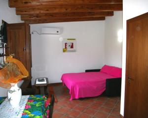 Giường trong phòng chung tại Case Vacanza Teulada