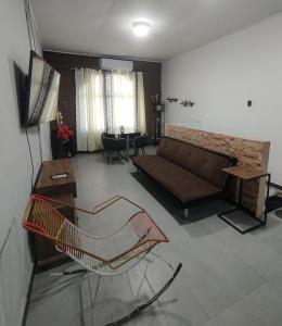 a living room with a couch and a table at Departamento Yavari in Iquitos