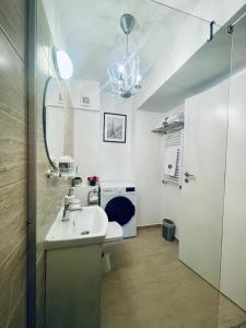 a bathroom with a sink and a mirror at Casa Cara in Târgovişte +32 photos
