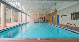 a large swimming pool in a large building at Skiers Lodge in Park City