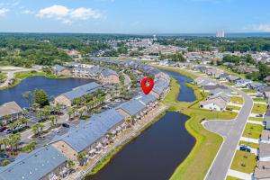 an aerial view of a resort with a red marker at 215 C2 GP-The Treehouse in Coffeyville