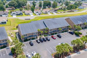 an aerial view of a town with cars parked in a parking lot at 215 C2 GP-The Treehouse in Coffeyville