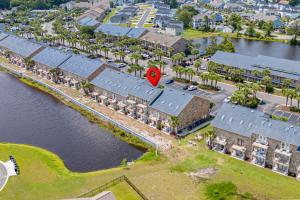 an aerial view of a resort with a red marker at 215 C2 GP-The Treehouse in Coffeyville