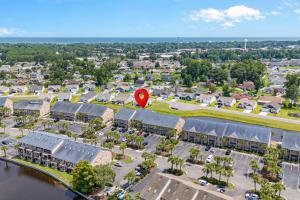 an aerial view of a town with a red kite at 215 C2 GP-The Treehouse in Coffeyville +42 photos