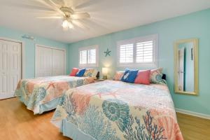 a bedroom with two beds and a ceiling fan at Golf Getaway with Pool Access Little River Home! in Little River +21 photos