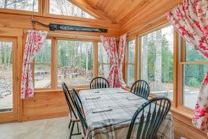 a dining room with a table and chairs and windows at Family-Friendly Brooks Gem with Spacious Yard! in Brooks
