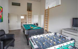 a living room with a pool table in a room at Amazing Home In Grenaa With Wifi in Grenå