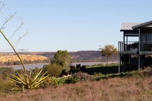 a house on a hill with a view of a river at Wongulla Heights in Wongulla