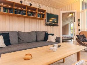 a living room with a couch and a coffee table at 8 person holiday home in Bogense-By Traum in Bogense