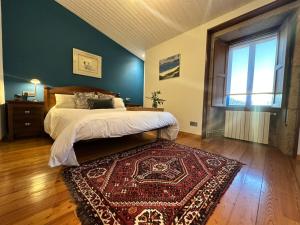 Cama o camas de una habitación en Casa do Bidueiro