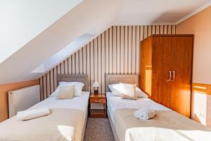 Postel nebo postele na pokoji v ubytování Zajazd Żuławy - Restauracja & Hotel