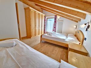 Posteľ alebo postele v izbe v ubytovaní Rossetti Big by AMA Val di Fassa