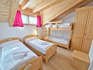 Posteľ alebo postele v izbe v ubytovaní Rossetti Big by AMA Val di Fassa