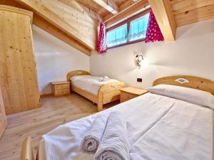 Posteľ alebo postele v izbe v ubytovaní Rossetti Big by AMA Val di Fassa
