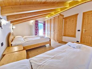 Posteľ alebo postele v izbe v ubytovaní Rossetti Big by AMA Val di Fassa
